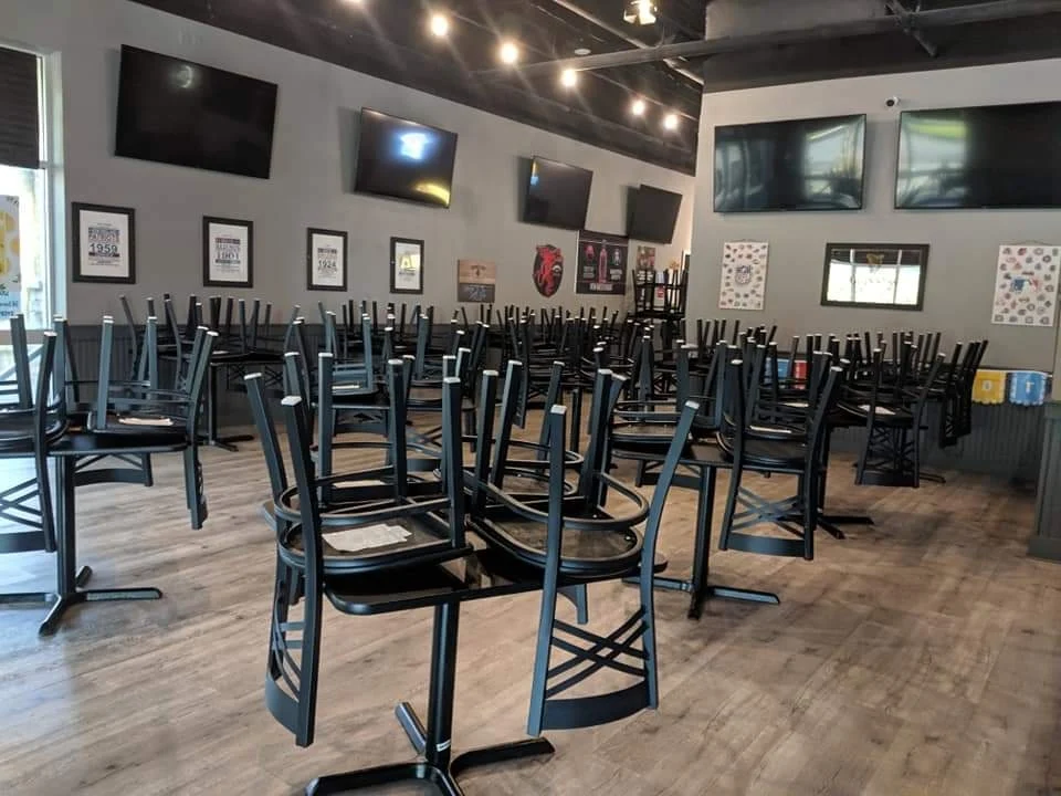 Clean restaurant dining room with chairs stacked on tables after nightly commercial janitorial service in Savannah, GA